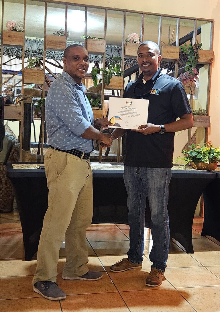 Alvin Brown receiving Belize Tourism Board National Tour Guide Training certificate in June 2025