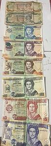 Old Belize banknotes featuring Queen Elizabeth II before the 2025 currency redesign.