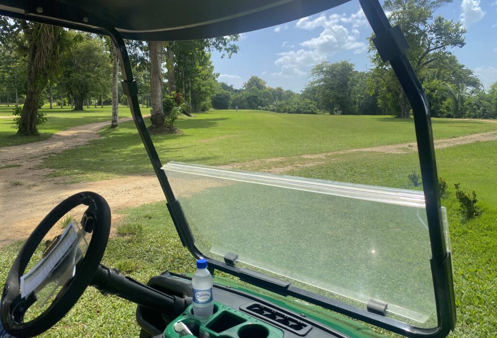 View of Roaring River Golf Course from a golf cart in Belize
