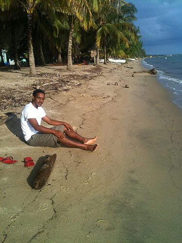 Hopkins Beach, Belize – Alvin J. Brown, 2012 Alvin sitting on Hopkins Beach in 2012, reflecting on Belize’s coastal life